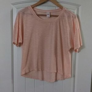 Light pink short sleeve shirt.